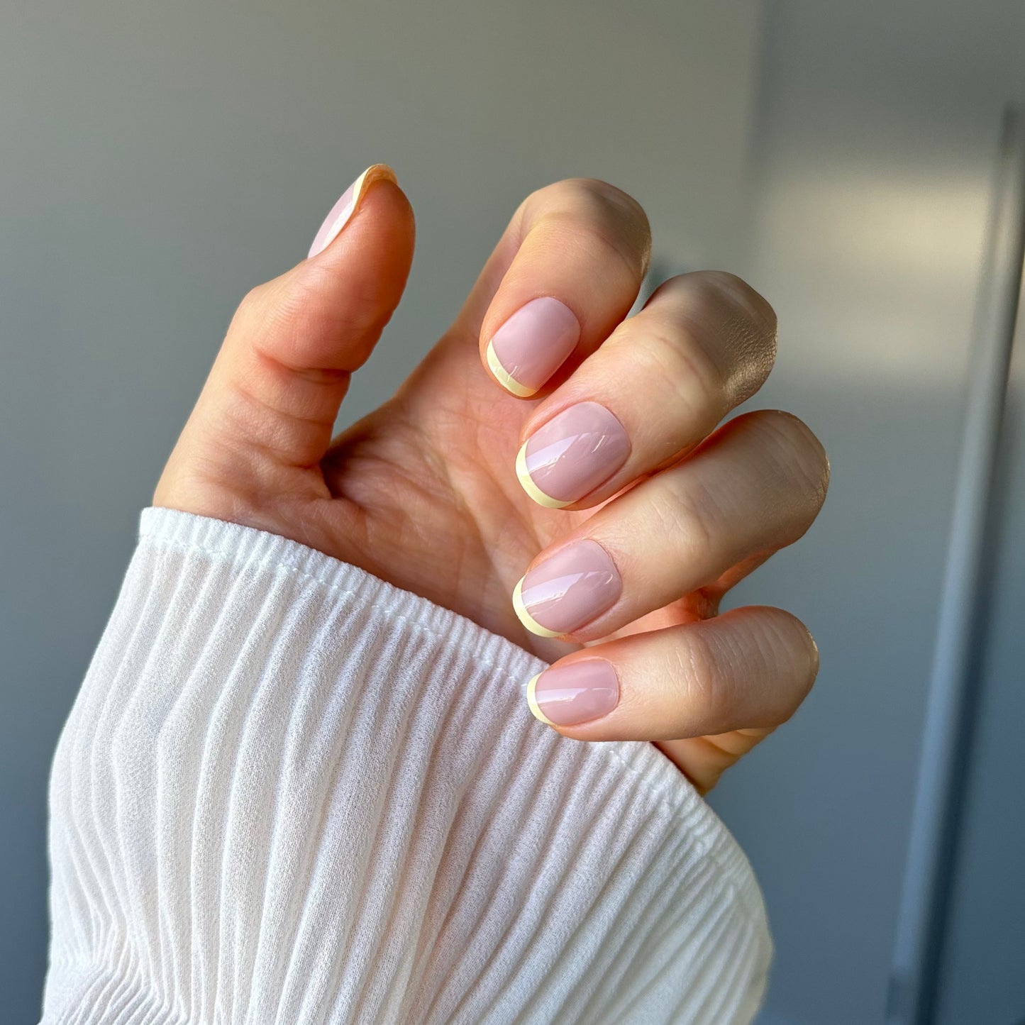 Candy Claws bon bon (extra-short) reusable acrylic nails. French manicure style with light yellow tips. Salon quality. Easy to apply & remove.