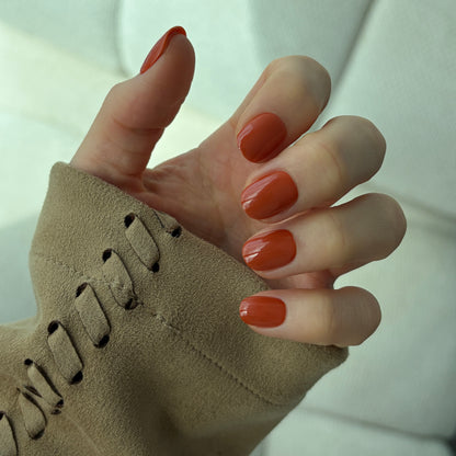 Salon quality reusable pumpkin spice false nails in a burnt orange colour for Halloween 